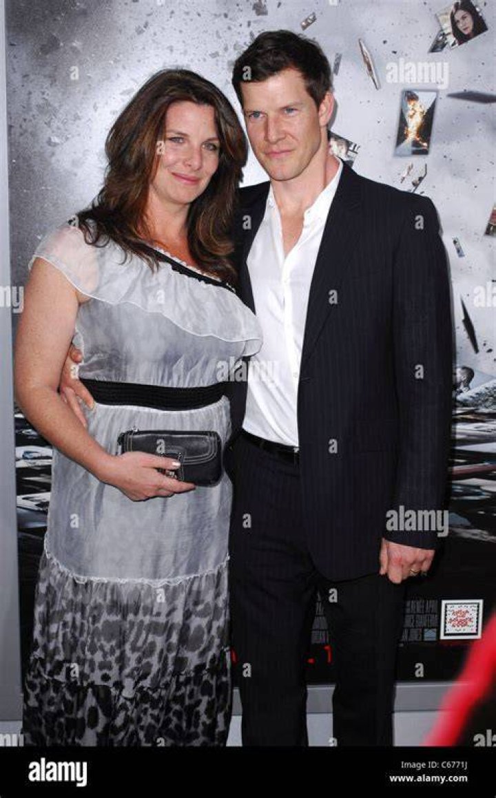 Eric Mabius, wife at arrivals for SOURCE CODE Premiere, Arclight