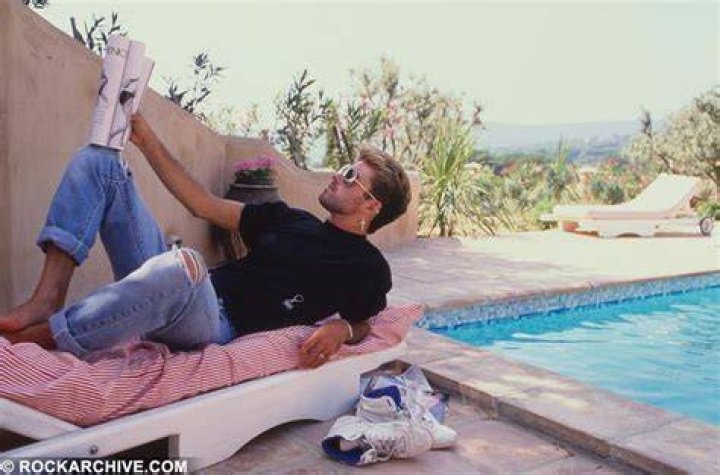 George Michael relaxing at home, listening to music
