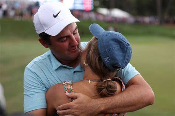 Scottie Scheffler hugs wife Meredith after Players Championship win