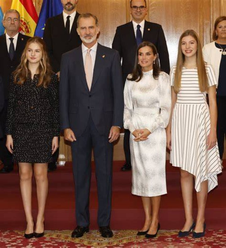 the spanish royal family poses for a photo in front of an old building