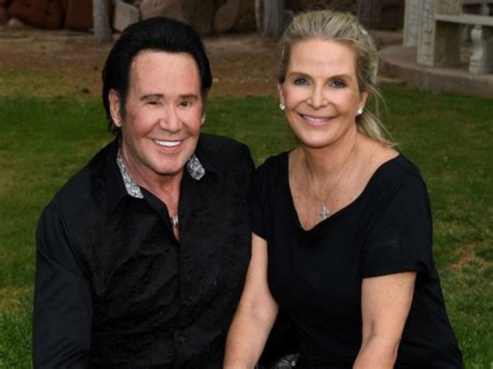 Wayne Newton and his wife Kat Newton holding their newborn son, Carson